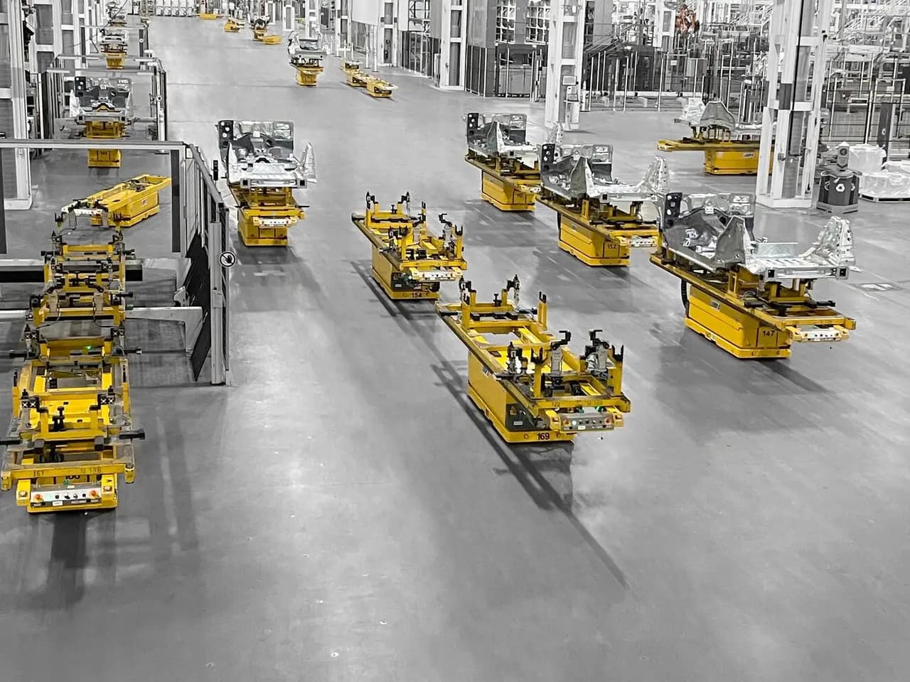 A fleet of KUKA automated guided vehicles in a car plant
