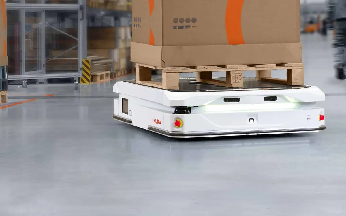 A KUKA autonomous mobile robot carrying a pallet